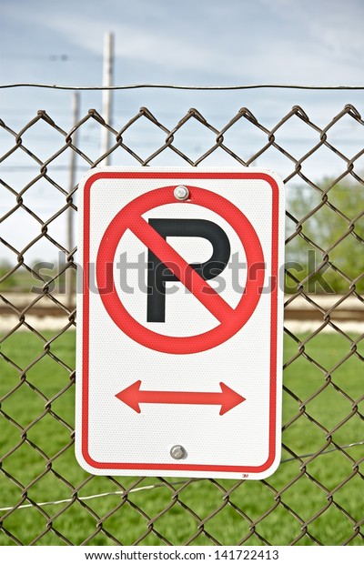 No Parking\
Sign on Fence. No Parking Along\
Fence