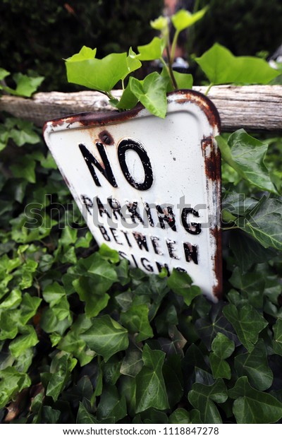 No Parking Sign on Wooden Fence. Traffic,\
Driving and Transportation