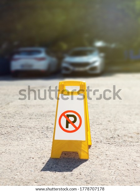 No parking sign at\
the outdoor car park