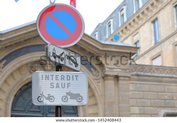 No parking sign Paris France. Translation for\
French - Except motorbikes.