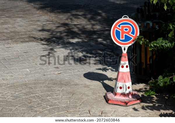 No Parking sign or Parking is prohibited. Temporary
portable road sign.