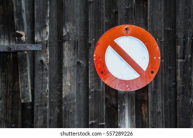 no parking traffic sign on a wooden garage door