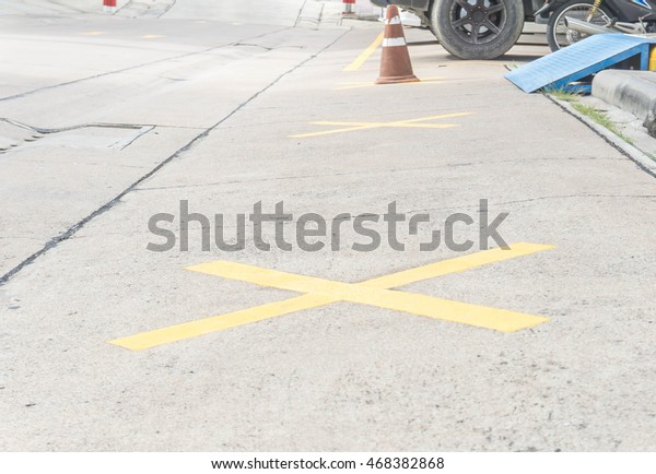 No parking yellow line\
cross zone.