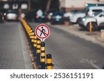 A "No Pedestrian" sign against the backdrop. The sign indicates a prohibition on walking in the area, reflecting urban safety measures in the city. 