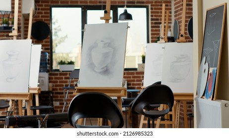 No people in artistic workshop used to teach drawing skills with canvas, easel, pencils and fine art instruments. Empty art class space for creative lesson to practice and draw sketch on paper. - Powered by Shutterstock