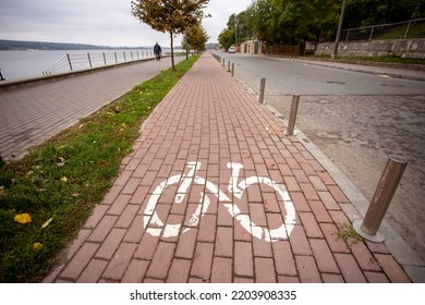 No People. Bicycle Sign Painted On Path In Public City Park Near Lake. Cycling In Specially Designated Area. Road Concept For Bicycle Owners.