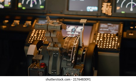 No People In Empty Aviation Cabin With Engine Lever On Dashboard And Control Panel Command. Airplane Cockpit With Power Switch And Buttons, Radar Compass And Windscreen. Close Up.