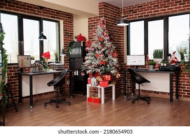 No people in empty business office with festive decor, christmas tree and seasonal holiday ornaments to celebrate winter tradition in corporate startup workplace. Xmas season decorations. - Powered by Shutterstock