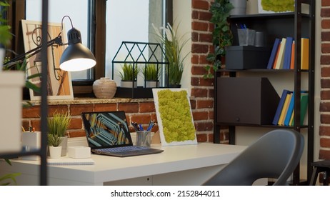 No People At Empty Desk With Laptop Computer In Apartment, To Use Modern Digital Technology For Entertainment. Nobody At Home Office With Interior Decorations, Creative Indoors Style.