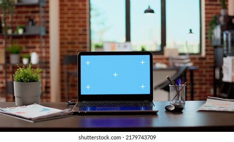 No People In Empty Office With Greenscreen Display On Laptop, Isolated Copyspace Template On Modern Computer. Blank Chroma Key Background With Mockup Screen On Pc Network At Desk.