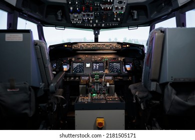 No People In Empty Plane Cockpit With Dashboard Command And Power Buttons, Switch, Lever And Handle. Nobody In Cabin With Control Panel Navigation And Radar Compass, Engine Throttle.