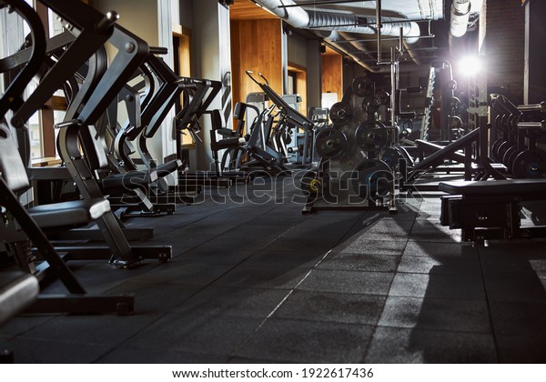 No people photo of an empty gym well-equipped\
with all kinds of machines