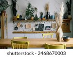 No people shot of handmade ceramic products on wooden table and shelves in modern pottery workshop, copy space