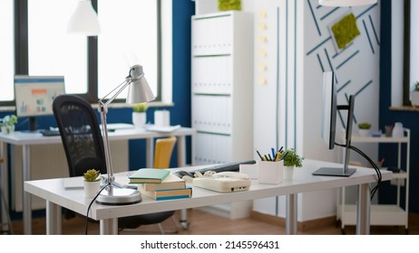 No People In Startup Office Used For Business Development, Professional E Commerce Workplace With Computer. Nobody At Desk With Sales Charts And Financial Statistics Software.