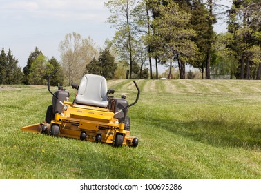 No Person On Expansive Lawn With A Yellow Zero-turn Mower