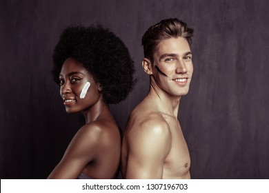 No Prejudices. Joyful International Couple Smiling While Standing Together