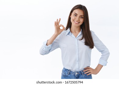 No Problem. Confident And Relaxed Young Professional Woman Assure She Can Deal With Anything On Her Own, Empowered Strong Lady At Work Show Okay Gesture And Smiling Satisfied, White Background