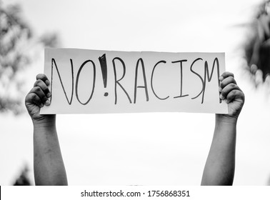 No racism End racism.Equality, protesters people on street.black african american man raised hands showing sign board revolution protest.Black Lives Matter.Justice USA.Stop asian hate.asian lives. - Powered by Shutterstock