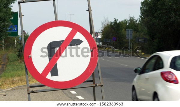 no right turn sign on busy uk motorway traffic\
in sunny afternoon in england\
uk