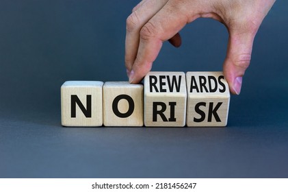 No Risk Or Rewards Symbol. Businessman Turns Wooden Cubes And Changes Words 'no Risk' To 'no Rewards'. Beautiful Grey Background. No Risk Or Rewards And Business Concept. Copy Space.