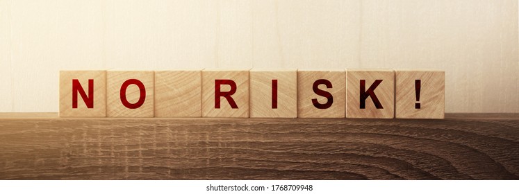 No Risk Words Letters On Wooden Cubes. Low Investment Risks Business Concept. Coronavirus Risks Alert Covid-19 Prevention Concept