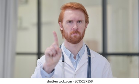 No Sign By Finger By Redhead Male Doctor 