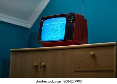 No signal just noise on old analogue TV set in the dark room