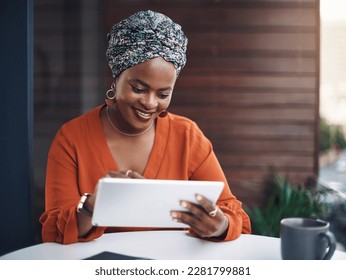 No simpler way to work. an attractive businesswoman working on her tablet in the office. - Powered by Shutterstock