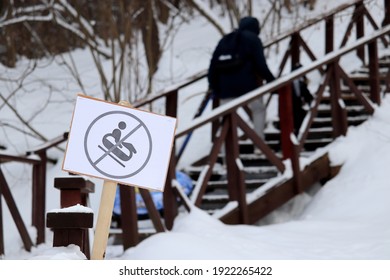 No Sledding Sign In The Snowy Park. Children Safety During Winter Holidays