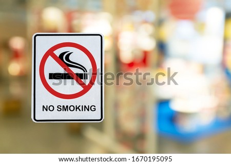 No Smoking label in the public with blur nature background.
