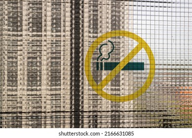 
No Smoking Sign Affixed To Frosted Glass