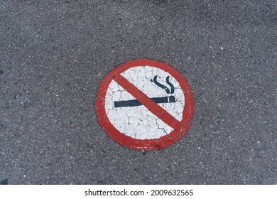 No Smoking Sign Near A Hospital Painted On The Asphalt