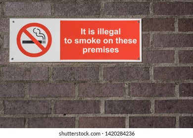 No Smoking Sign On A School Wall.