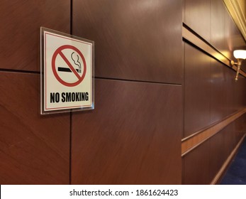 No Smoking Sign On Wooden Wall. Perspective Image.