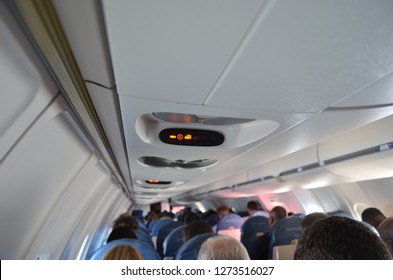 No Smoking Sign Overhead On Airplane