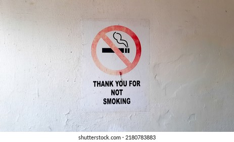 No Smoking Sign In A Room, Pasted On The Wall