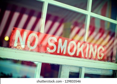 No Smoking Sign In The Window Of A Restaurant