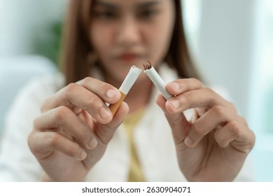 No fumar. La mujer deja de fumar, rechaza, rechaza, rompe, toma el cigarrillo, dice no. deja de fumar por salud. Día mundial del tabaco. drogas, cáncer de pulmón, enfisema, enfermedad pulmonar, narcótico, efecto de la nicotina
