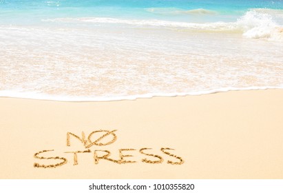 No stress concept written on the sand of an exotic beach