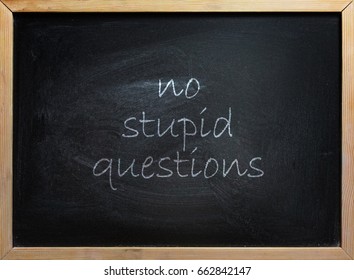 No Stupid Questions Text Written On Black School Board With Wooden Frame.
