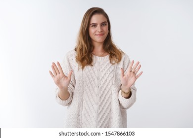 No Thanks. Portrait Of Friendly-looking Polite Woman Declining Uninteresting Offer Smiling Sorry Grin, Raising Palms Waving Refusal Gesture, Rejecting Proposal Unwilling Participate, Reluctant