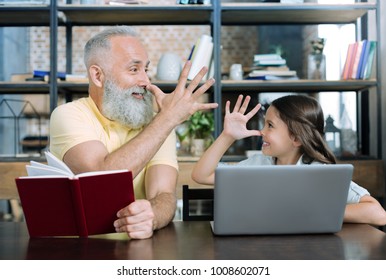 No Time For Worries. Waist Up Shot Of Two Generations Of A Family Looking At Each Other And Joking While Spending Free Time Together.