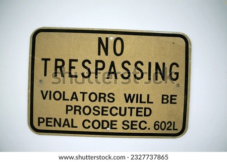 NO TRESPASSING. An old No Trespassing metal sign. Isolated on white. Room for text. Reflective Warning No Trespassing Sign. No Trespassing. Violators will be Prosecuted. Penal code sec. 602L. Warning.