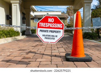 No trespassing sign and cone on property