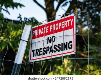 no trespassing sign on a fence