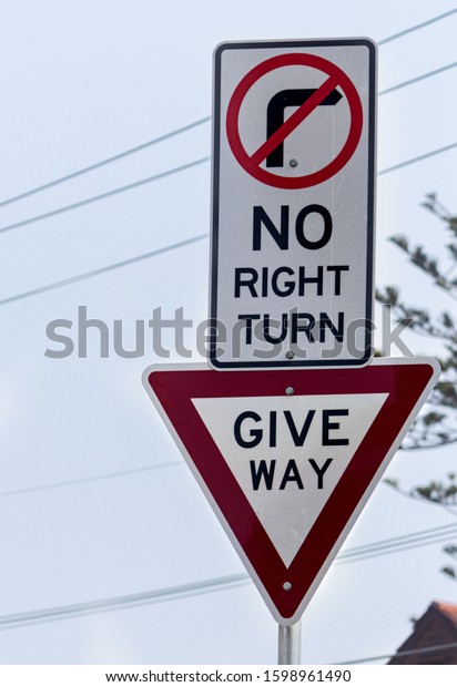 No turn right and Give\
way. Signpost is forbidden to enter right and with the sign give\
preference.