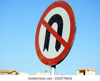 No U-turn sign, a regulatory sign posted at intersections to indicate the driver is not legally allowed to make a U-turn (a turn in the road to go the opposite direction), selective focus