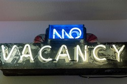 No Vacancy Neon Sign, Lit Up In Yellow And Blue Neon