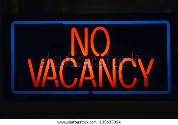 No Vacancy sign of a\
motel at night