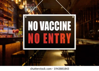 No Vaccine No Entry Sign at a bar, tavern or pub. Proof or vaccination required to enter a shop or business establishment. - Shutterstock ID 1943881843